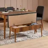 A bench with storage is placed in front of a dining table with chairs. Podgląd zdjęcia produktu
