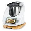 A white kitchen appliance with a touchscreen display showing a food image, resting on a wooden base. Produktbild-Vorschau