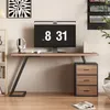 A modern home office setup featuring a desk with a computer, headphones, and a drawer unit. Anteprima dell’immagine prodotto