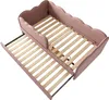 A pink upholstered daybed with a pull-out trundle bed, both showing wooden slats. Produktbild-Vorschau