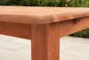 Close-up of a wooden table corner outdoors. Produktbild-Vorschau