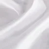 A close-up of white fabric with folds and creases, showing a subtle sheen. Produktbild-Vorschau