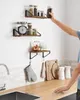 A person is reaching for a jar on a kitchen shelf. Náhled obrázku produktu