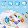 A collection of colorful glass marbles displayed on a white plate with a white bunny figurine, with marketing text and icons at the top. Náhľad obrázku produktu