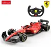 A red remote-controlled Ferrari Formula 1 car with a steering wheel controller and the Ferrari logo. Podgląd zdjęcia produktu