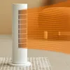 A white tower heater is shown on a rug, with orange wavy lines indicating heat being emitted. Podgląd zdjęcia produktu