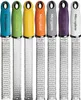 A row of seven Microplane graters with different colored handles. Anteprima dell’immagine prodotto