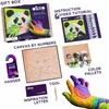 A collage of items included in a DIY art kit, including the gift box, instructions, canvas, color palettes, and tools. Produktbild-Vorschau