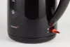Close-up of the lower part of a black electric kettle, showing the brand name and the power switch. Produktbild-Vorschau
