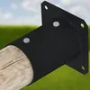 A black metal bracket attached to a wooden post, set against a blurred background of green grass and a blue sky. Produktbild-Vorschau
