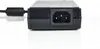 A close-up, studio shot of the input end of a power adapter. Produktbild-Vorschau