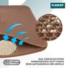 A close-up view of a brown cat litter mat, showing its honeycomb design and how it traps litter. Blue arrows indicate the flow of litter into the mat's layers. Produktbild-Vorschau