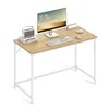 A modern desk setup with a computer, keyboard, mouse, and a vintage-style speaker on a light wood desk with white legs. Produktbild-Vorschau
