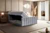 A bedroom scene with a bed featuring an open storage compartment. Produktbild-Vorschau