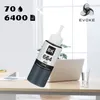 A bottle of black printer ink is placed on a desk next to a laptop and a glass of water. Produktbild-Vorschau
