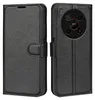 A black leather flip cover wallet case for a smartphone is shown from two angles. Produktbild-Vorschau