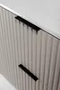 A close-up view of a beige cabinet with two black handles. Anteprima dell’immagine prodotto