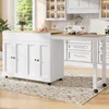 A white kitchen island with a wooden countertop is shown in a bright, modern kitchen setting. The island has cabinet doors and is on wheels. A rug is on the floor in front of it. There are wine glasses and some decorative items on the countertop. Anteprima dell’immagine prodotto