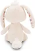 A plush toy bunny seen from the back, sitting down. Produktbild-Vorschau