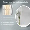 A marketing image showing a round LED bathroom mirror with a floral arrangement in front of it, and a diagram illustrating the mirror's construction. Anteprima dell’immagine prodotto