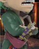 A close-up view of a figurine's torso and swords, with a blurred background. Anteprima dell’immagine prodotto
