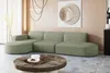 A modern living room with a sectional sofa, coffee table, and wall art. Produktbild-Vorschau