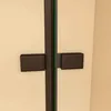 A close-up view of a shower enclosure's dark gray frame and glass with a thin green line visible between the panels. Produktbild-Vorschau