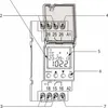Close-up view of a digital timer with labels and connection terminals. Náhled obrázku produktu