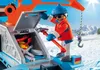 A toy figure operating a snow vehicle in a snowy mountain environment. Podgląd zdjęcia produktu
