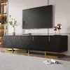 A modern living room scene featuring a black TV stand with gold accents and a television mounted above it. Anteprima dell’immagine prodotto