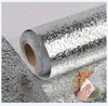 A roll of silver, textured adhesive foil or wallpaper. Produktbild-Vorschau