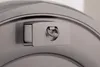 A close-up shot of a metallic ring attached to a curved surface, possibly a washing machine. Produktbild-Vorschau