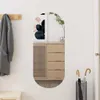 A hallway or entryway scene with a coat hanging on a rack, a cabinet with a mirror, and an umbrella stand. Náhled obrázku produktu