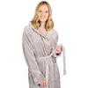 A woman wearing a gray bathrobe. Produktbild-Vorschau
