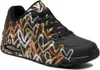 A single black sneaker with a metallic heart pattern. Anteprima dell’immagine prodotto