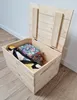 A wooden chest with its lid open, containing some items inside. The chest is placed on a wooden floor. Náhled obrázku produktu