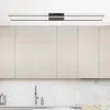 A modern kitchen with light-colored cabinets and a sleek ceiling light. Voir les images du produit