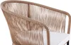 Close-up of a beige rope lounge chair with a white cushion. Produktbild-Vorschau