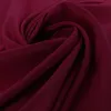 A close-up, swirled view of burgundy fabric. Podgląd zdjęcia produktu