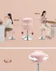 Collage showing a pink stool being used by two different women, with measurements and features highlighted. Náhled obrázku produktu