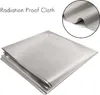 A folded piece of radiation-proof cloth is shown, with a close-up inset of the fabric's texture. Produktbild-Vorschau