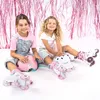 Two young girls sitting on the floor with roller skates and helmets. Produktbild-Vorschau