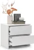 A white nightstand with two drawers, one of which is open, displaying decorative items on top. Náhľad obrázku produktu