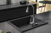 A modern kitchen sink with a faucet. Náhled obrázku produktu