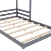 A close-up view of the slatted base of a gray wooden bed frame. Produktbild-Vorschau