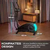 A black elliptical trainer is shown in a room with wooden floors and curtains. Dimensions are indicated with text overlays. Produktbild-Vorschau