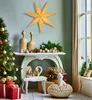 A festive Christmas scene with a decorated tree, gifts, and decorative items on a console table. Voir les images du produit