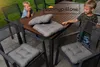 Two children are sitting at a patio table with cushions on chairs. Produktbild-Vorschau