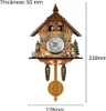 A detailed shot of a wooden cuckoo clock with decorative elements and measurements indicated. Produktbild-Vorschau