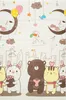 A children's play mat with cartoon animals and city graphics. Produktbild-Vorschau